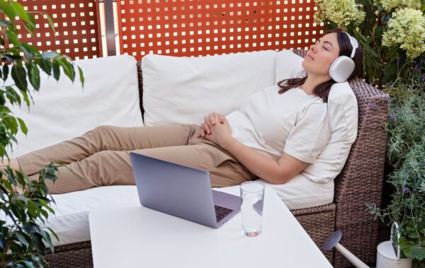Young woman having online clinical  hypnotherapy regression session